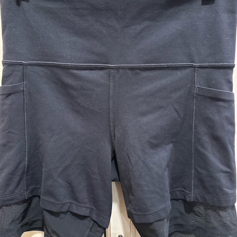Women’s black athletic Shorts with mesh bottoms